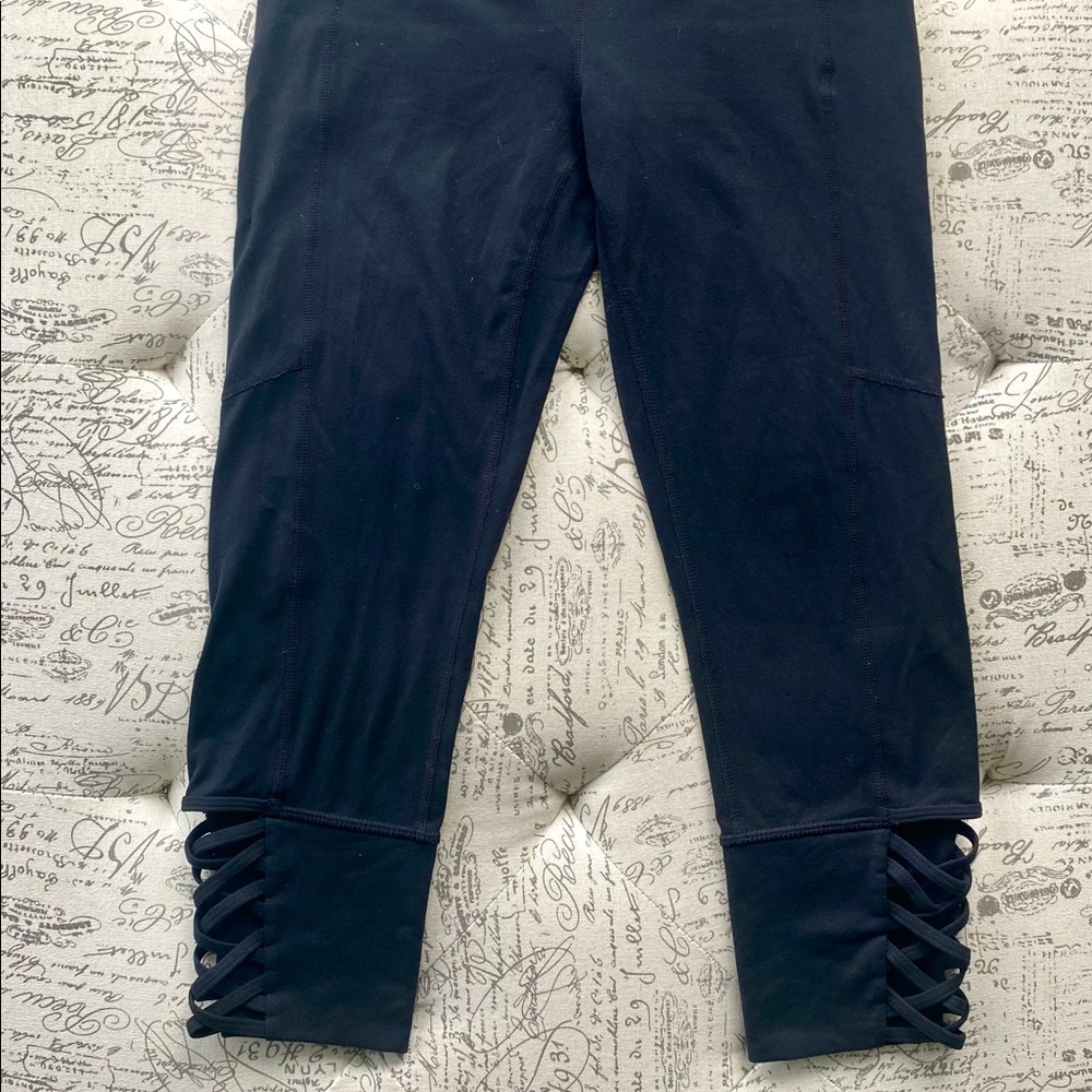 Athleta XS black capri with fun elastic side details! Excellent condition.
